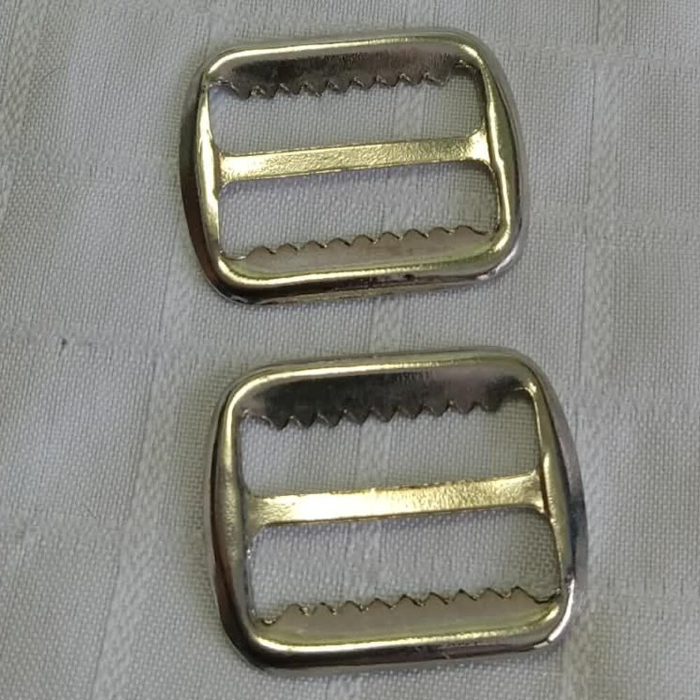G- Two vintage fasteners for adjusting overalls straps
